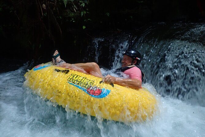 Bali Canyon Tubing Adventure - Tubing the jungle stream: inflatable tube, bridges, and obstacles