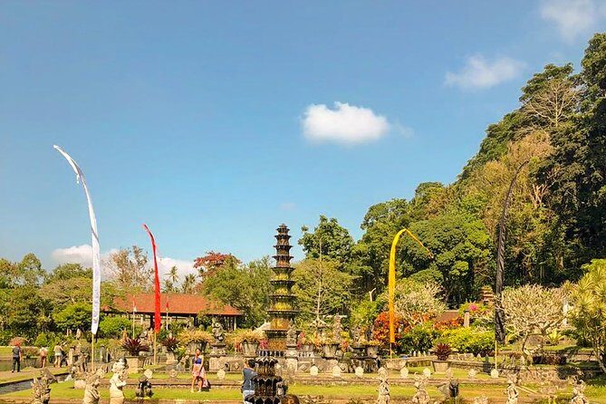 East Bali Tour, Lempuyang - Tirta Gangga - Ujung Soekasada - Black sand Beach - Tirta Gangga: Koi Ponds, Clear Water, and Fish Food Fun